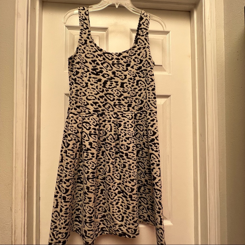 Aqua dress. Size large. Black and cream animal type print. Fit and flare style.